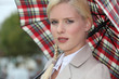 Snobby woman holding an umbrella