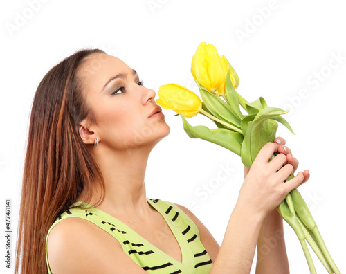 Photo: happy woman with yellow tulips over white background happy woman with yellow tulips over white background