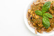 pasta in a basil pesto sauce with diced chicken breast