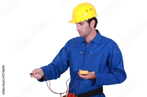 Photo: electrician taking reading electrician taking reading