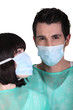 Surgeons wearing face masks