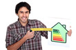 Man with an energy rating sign