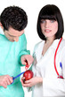 Surgeon operating on apple