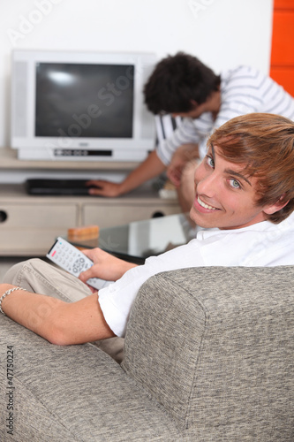 Photo: Turning on the TV. Turning on the TV.