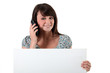 woman with a cellphone and a board for message