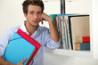 Office worker posing with his files