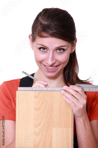 Photo: Young woman measuring plank Young woman measuring plank