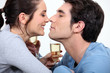 couple with flute of champagne canoodling