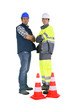 Two road workers stood by traffic cones