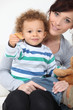 Boy eating cookies.