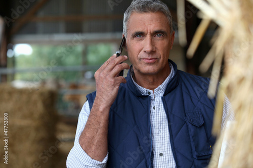 Photo: Farmer on the phone Farmer on the phone