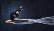 Young woman in gymnast suit posing