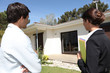 Estate agent about to show customer around property
