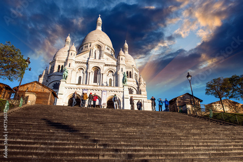 Photo: Beautiful sunset colors over Sacred Heart Cathedral in Montmartr Beautiful sunset colors over Sacred Heart Cathedral in Montmartr
