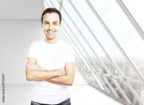 Photo: man in T-shirt in room man in T-shirt in room