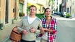 Video: Couple with basket walking along the street in the city, steadyc Couple with basket walking along the street in the city, steadyc