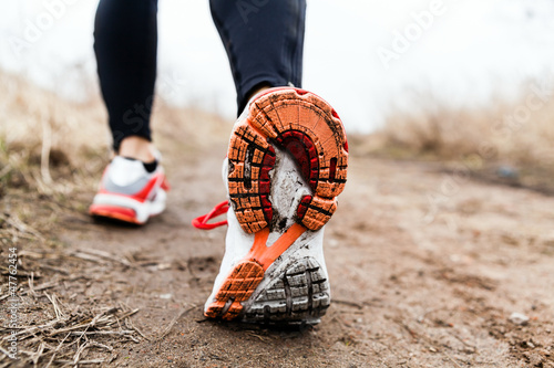 Photo: Walking or running legs sport shoes Walking or running legs sport shoes