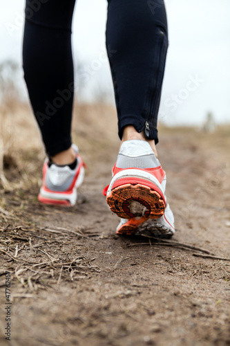 Photo: Walking or running legs sport shoes Walking or running legs sport shoes
