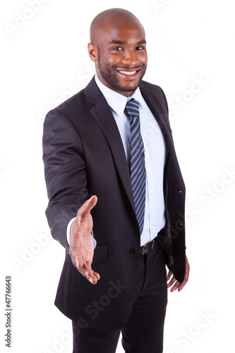 Photo: A black businessman giving a hand A black businessman giving a hand