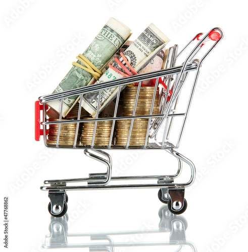 Photo: shopping trolley with dollars and Ukrainian coins, isolated shopping trolley with dollars and Ukrainian coins, isolated