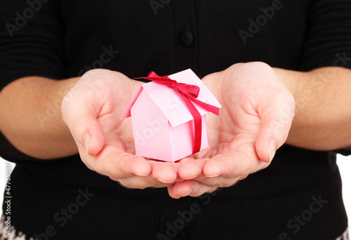 Photo: Small house in hands Small house in hands