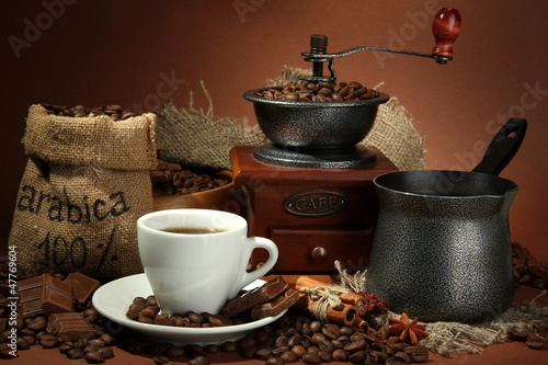 Photo: cup of coffee, grinder, turk and coffee beans cup of coffee, grinder, turk and coffee beans