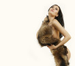 Photo: young woman in a fur coat young woman in a fur coat