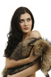 Photo: young woman in a fur coat young woman in a fur coat