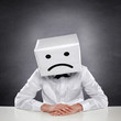 Unhappy Man with Box