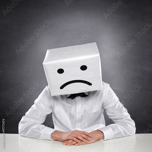 Photo: Unhappy Man with Box Unhappy Man with Box