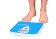 Photo: Man's legs ,which weighed on floor scale. Isolated Man's legs ,which weighed on floor scale. Isolated