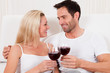 Couple toasting with red wine
