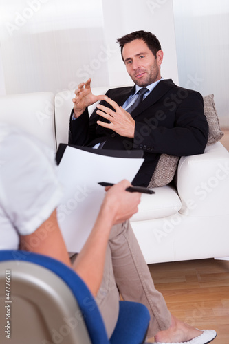 Photo: Man talking to his psychiatrist Man talking to his psychiatrist