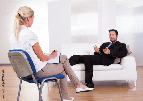 Photo: Man talking to his psychiatrist Man talking to his psychiatrist