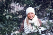 happy woman under snowfall