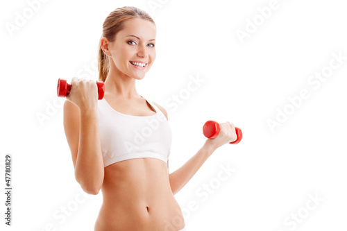 Photo: beautiful woman holding dumbbells beautiful woman holding dumbbells