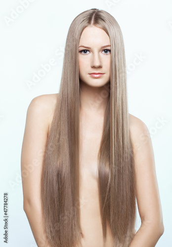 Photo: Portrait of young woman with long hair Portrait of young woman with long hair
