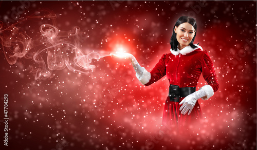 Photo: Portrait of girl wearing santa claus clothes Portrait of girl wearing santa claus clothes
