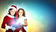 Little girl with christmas gifts and santa
