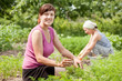 women  in field of carrot