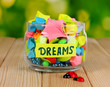 Glass vase with paper stars with dreams