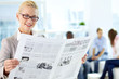 Woman with newspaper