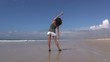 back woman exercising at beach 60