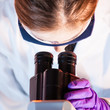 Researcher microscoping.