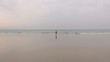 red jersey woman coming from the sea 40