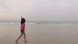 red jersey woman flying to the ocean