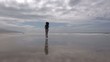 woman on beach jogging