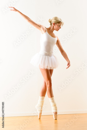Photo: Beautiful ballet dancer practicing dance posture Beautiful ballet dancer practicing dance posture