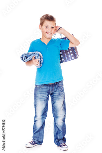 Photo: Boy holding shopping bag Boy holding shopping bag