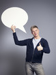 Friendly man presenting empty speech bubble.